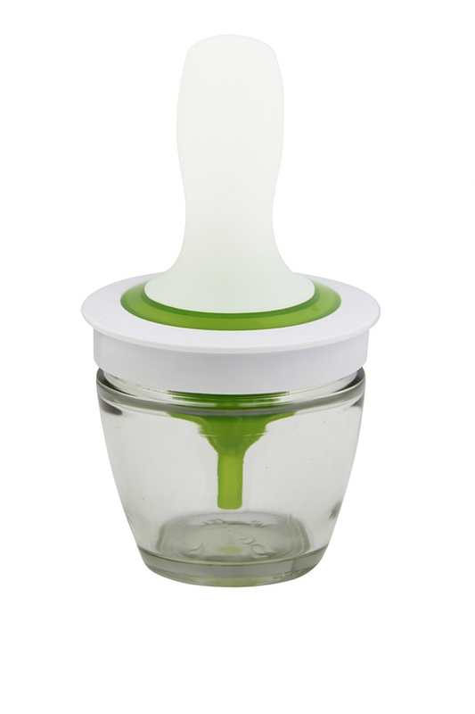 Glass container with a white and green lid on a white background